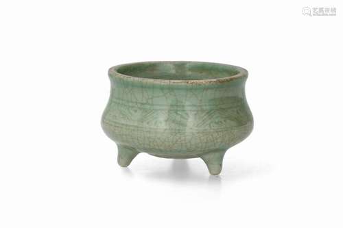 A celadon glazed porcelain tripod censer. Unmarked.