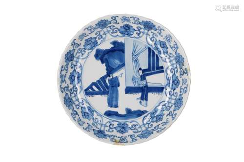 A blue and white porcelain dish with lobed and scal