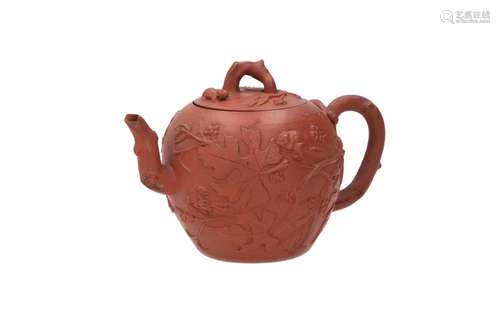 A Yixing teapot, decorated in relief with leaves an