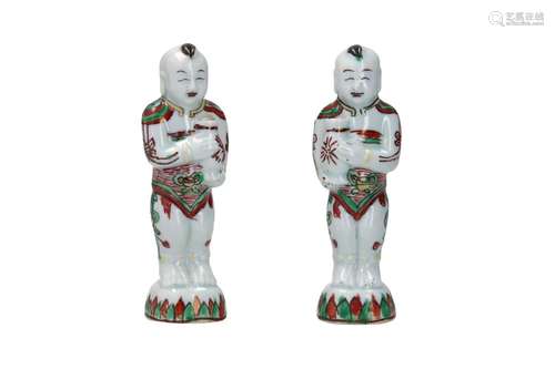 A pair of famille verte porcelain sculptures depict