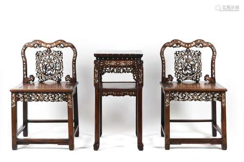 A pair of rosewood armchairs inlaid with mother-of-