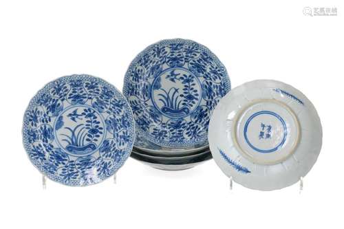 A set of six lobed blue and white porcelain saucers