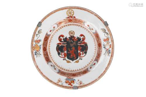 A polychrome porcelain armorial dish with a coat of