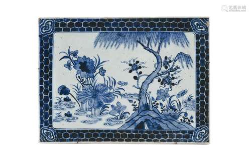 A blue and white porcelain plaque, depicting flower