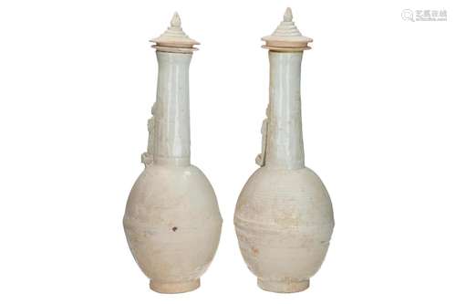 A pair of Qingbai lidded vases, decorated with a fi