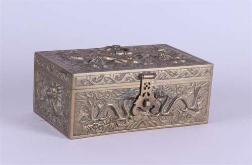 A lidded brass box decorated with dragons. China, 20th centu...