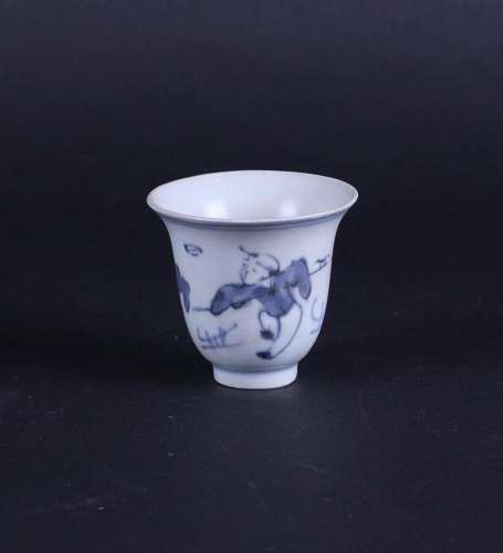 A porcelain cup decorated with playing boys. China, Ming.