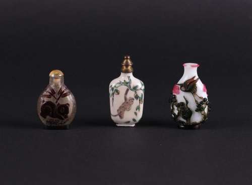 A lot of three snuff bottles including some in enamel. China...
