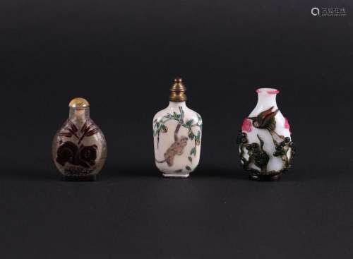 A lot of three snuff bottles including some in enamel. China...
