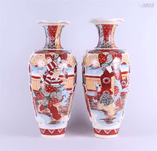 A set of two Satsuma earthenware vases decorated with variou...