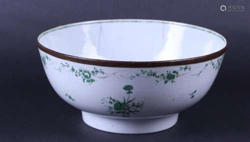 A large porcelain Chine de Commande bowl with a green decora...