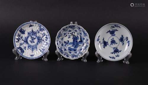 Three  different porcelain plates with floral decor, with fe...