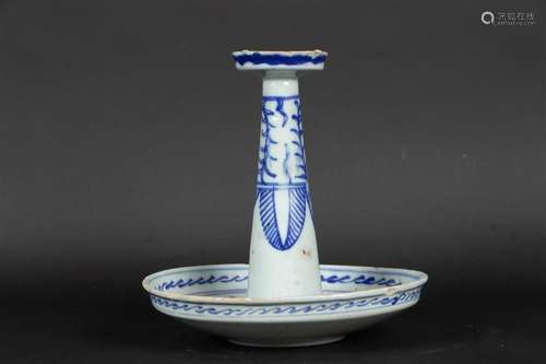 A porcelain blue and white oil lamp with floral decoration. ...