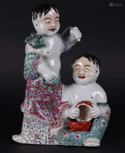 A porcelain famile rose group of two fools, marked on the bo...