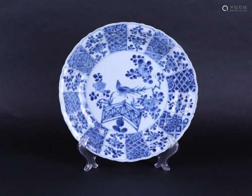 A porcelain dish decorated with a pheasant by a fence. China...