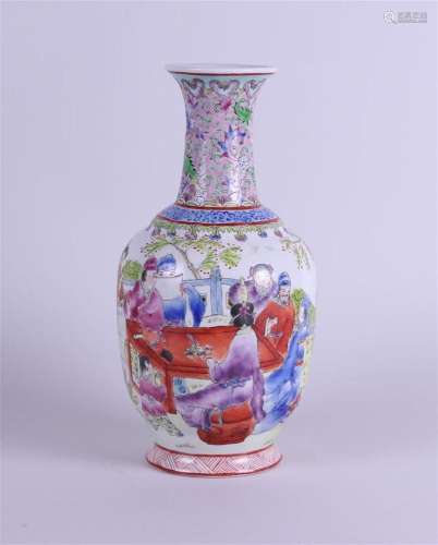 A porcelain vase decorated with various figures.