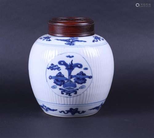 A large ribbed porcelain ginger jar decorated with various a...