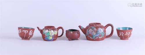 A lot of various Yixing earthenware including two teapots. C...
