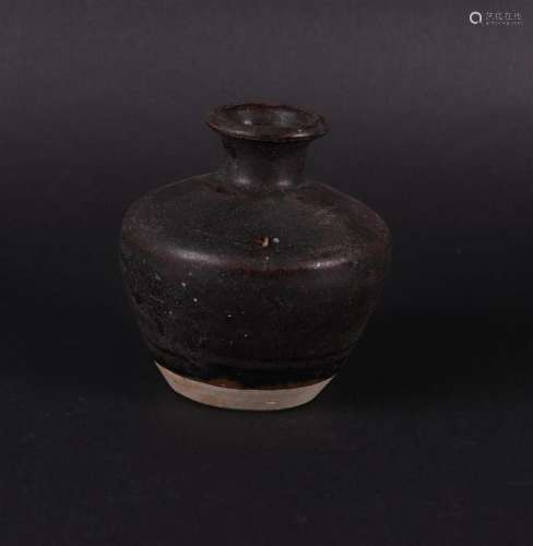 A large stoneware storage jar, dark grey. China early Ming.