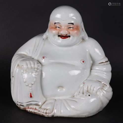A porcelain Buddha,  marked with a seal underneath. China, R...