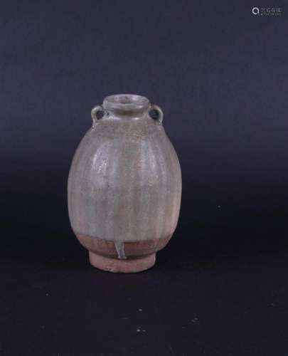 A ribbed Celadon vase with vertical relief decoration and tw...