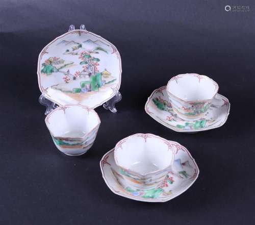 A set of three very thin cups and saucers with landscape dec...