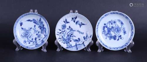 Three various porcelain plates with floral decor, one with t...