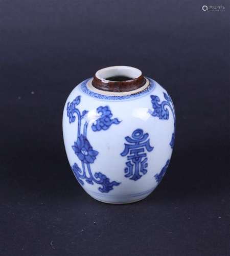 A porcelain storage jar decorated with characters. China, Ka...