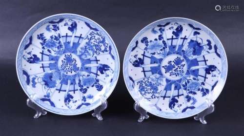 A set of two porcelain dishes decorated with flowers in flow...
