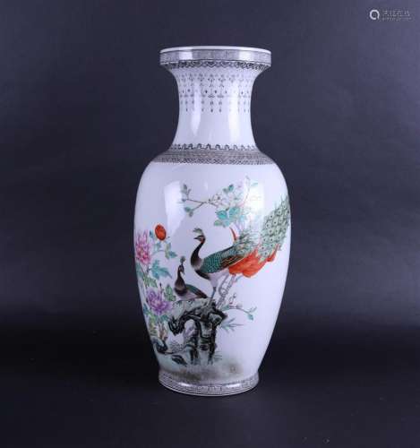 A large porcelain vase in Famile Rose decor with peacocks an...