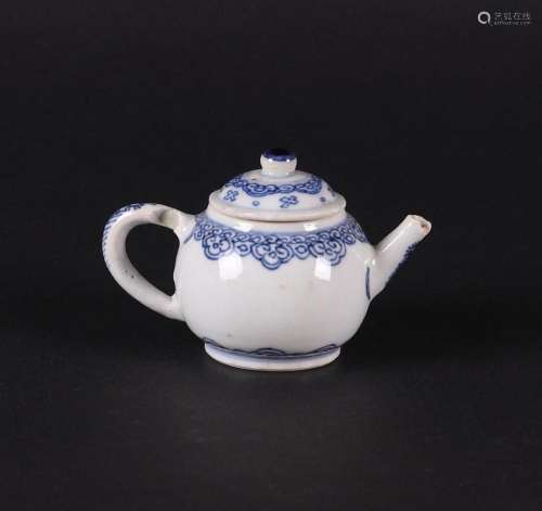 A porcelain small model teapot, with cloud motifs on the tea...