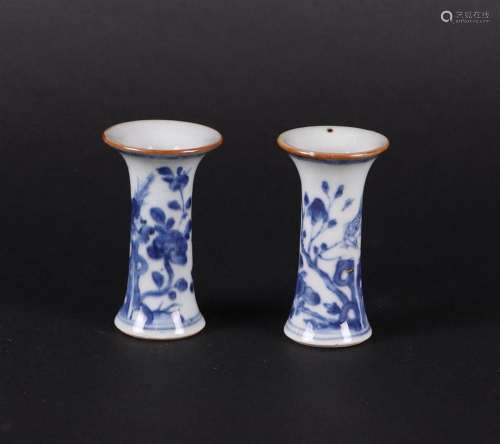 Two porcelain beaker vases with flared necks, decorated with...