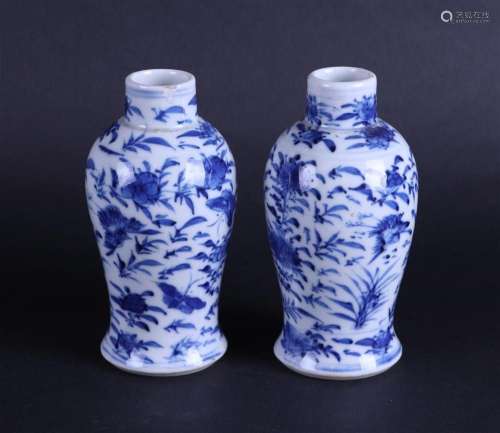 A set of two porcelain vases with floral decor, marked Kangx...