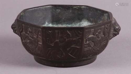 A bronze incense burner  cast with low relief figures. China...