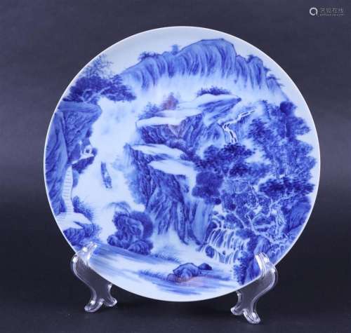 A porcelain dish with landscape decoration, marked Qianlong....