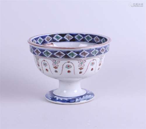 An Imari stem cup decorated with birds and blossoms on the i...