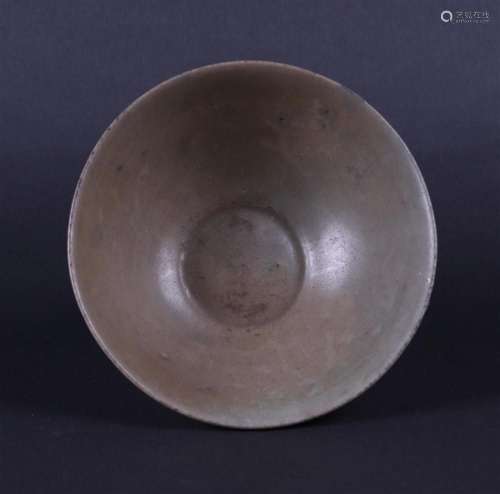 A celadon bowl with lotus relief. China, Yuan.
