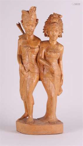 A Balinese carving of a bride and groom, Indonesia,