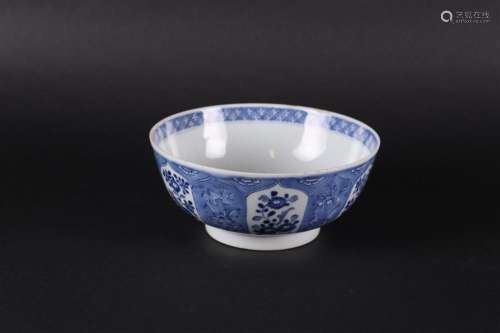 A porcelain bowl with a lotus leaf outer rim, filled with fl...