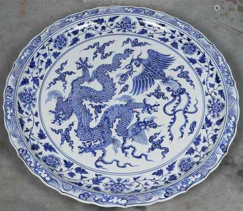 A very large porcelain dish with dragon decor. China, after ...