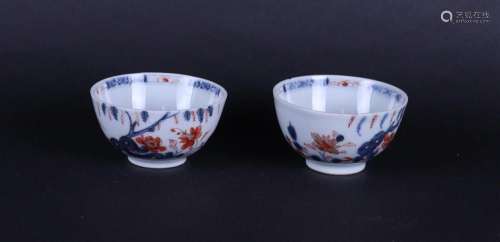 Two porcelain Imari bowls with floral decor under weeping wi...