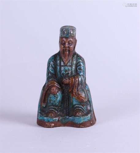 A green glazed pottery sculpture of an immortal, China, Ming...