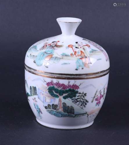 A porcelain Famile Rose lidded pot decorated with various fi...