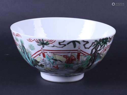 A porcelain Famile Verte bowl decorated with various figures...