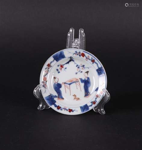 A porcelain Imari plate with long  Elizas at the table and a...