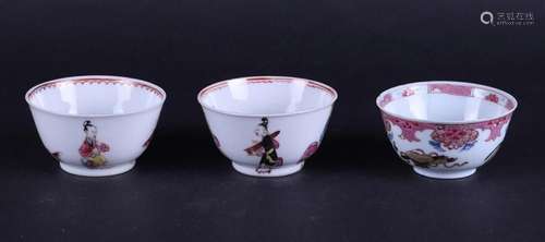 A lot of three porcelain Famile Rose cups and saucers, two o...