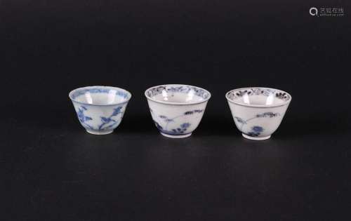 Three porcelain small cups with floral decoration. China, Yo...