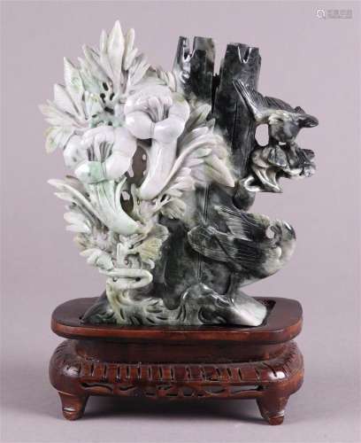 A jade sculpture of various flowers and a bird. China, 20th ...