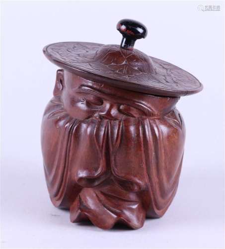 A wooden tobacco jar in the shape of a sage. China, circa 19...