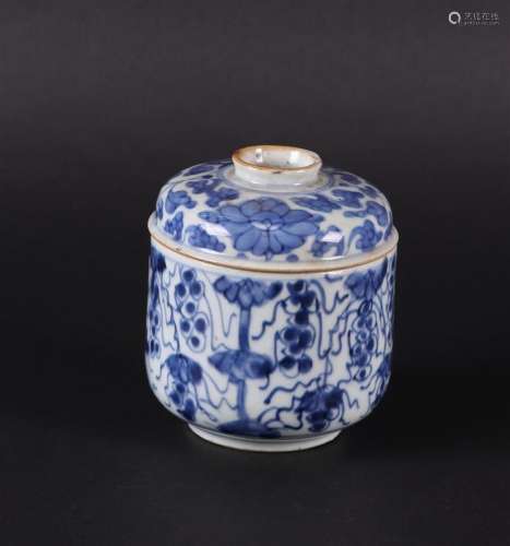 A porcelain sugar bowl with a flat lid, with floral decorati...